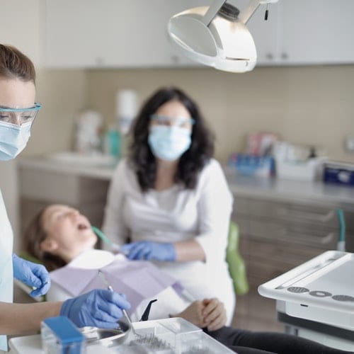 Dentist checking patient